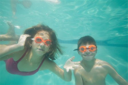 swimsuit underwater posing - Cute kids posing underwater in pool at the leisure center Stock Photo - Budget Royalty-Free & Subscription, Code: 400-07900886