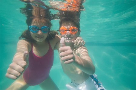 swimsuit underwater posing - Cute kids posing underwater in pool at the leisure center Stock Photo - Budget Royalty-Free & Subscription, Code: 400-07900888