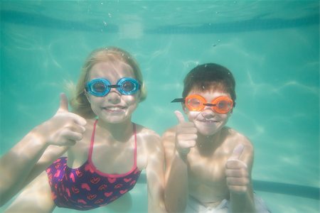 swimsuit underwater posing - Cute kids posing underwater in pool at the leisure center Stock Photo - Budget Royalty-Free & Subscription, Code: 400-07900890