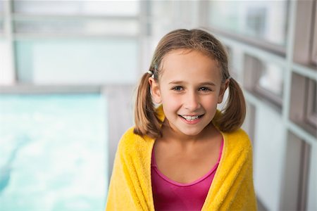 Cute little girl sitting poolside at the leisure center Stock Photo - Budget Royalty-Free & Subscription, Code: 400-07901041