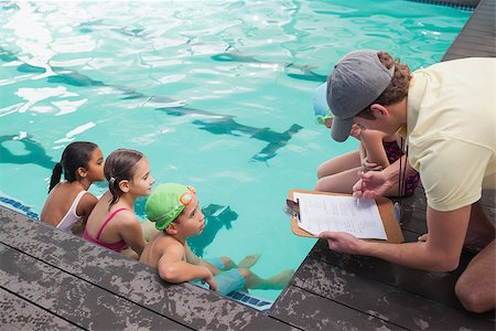 simsearch:640-06963379,k - Cute swimming class listening to coach at the leisure center Photographie de stock - Aubaine LD & Abonnement, Code: 400-07901061