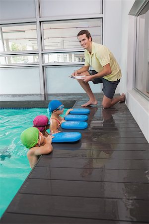 simsearch:640-06963379,k - Cute swimming class listening to coach at the leisure center Photographie de stock - Aubaine LD & Abonnement, Code: 400-07901062