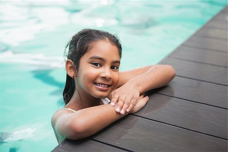 portrait of girl poolside - Cute little girl smiling in the pool at the leisure center Photographie de stock - Aubaine LD & Abonnement, Code: 400-07901072