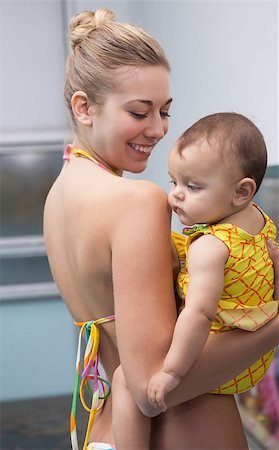 Pretty mother and baby at the swimming pool at the leisure center Stock Photo - Budget Royalty-Free & Subscription, Code: 400-07901124