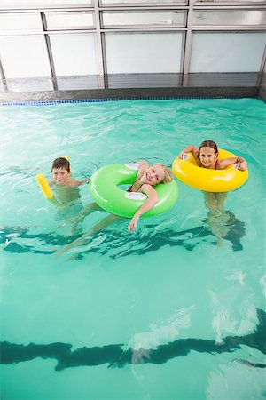 simsearch:400-05352235,k - Cute little kids in the swimming pool at the leisure center Photographie de stock - Aubaine LD & Abonnement, Code: 400-07901121