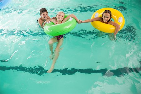 simsearch:640-02951323,k - Cute little kids in the swimming pool at the leisure center Stockbilder - Microstock & Abonnement, Bildnummer: 400-07901122