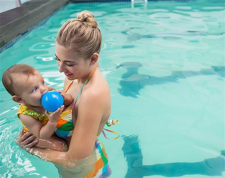 Pretty mother and baby at the swimming pool at the leisure center Stock Photo - Budget Royalty-Free & Subscription, Code: 400-07901133
