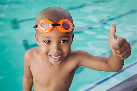 Cute little boy giving thumbs up at the pool at the leisure center Stock Photo - Budget Royalty-Free & Subscription, Code: 400-07901157