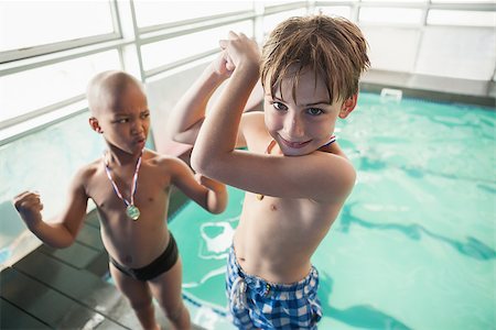 swimmer medal - Little boys standing by the pool with medals at the leisure center Stock Photo - Budget Royalty-Free & Subscription, Code: 400-07901181