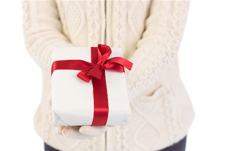 simsearch:400-07902186,k - Close up of a festive woman offering gift on white background Foto de stock - Super Valor sin royalties y Suscripción, Código: 400-07901334