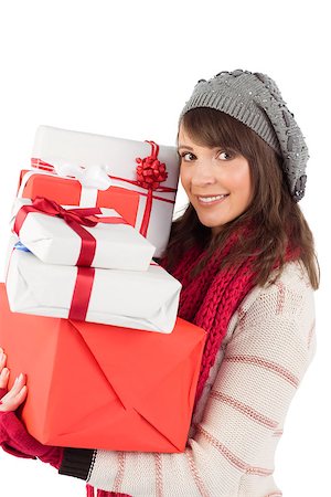 simsearch:400-07902186,k - Festive brunette holding pile of gifts on white background Foto de stock - Super Valor sin royalties y Suscripción, Código: 400-07901346