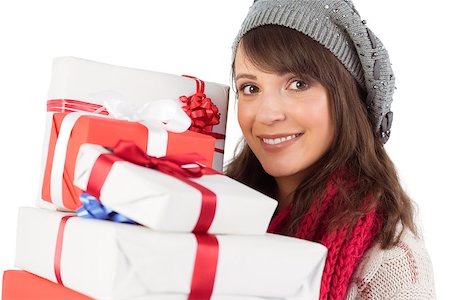 simsearch:400-07902186,k - Portrait of a pretty woman holding pile of gifts on white background Foto de stock - Super Valor sin royalties y Suscripción, Código: 400-07901347