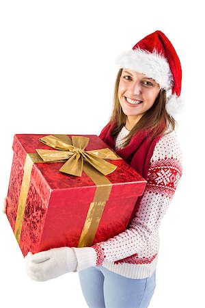 simsearch:400-07902186,k - Young woman holding a gift while smiling at camera on white background Foto de stock - Super Valor sin royalties y Suscripción, Código: 400-07901486