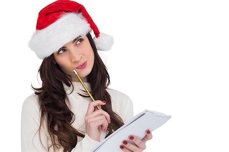 Festive brunette thinking about her christmas list on white background Stock Photo - Budget Royalty-Free & Subscription, Code: 400-07901602