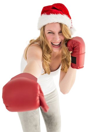 Festive blonde punching with boxing gloves on white background Photographie de stock - Aubaine LD & Abonnement, Code: 400-07901802