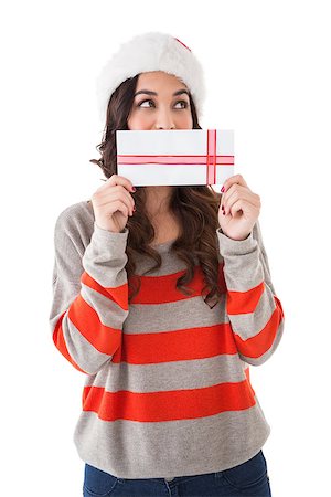 simsearch:400-07902186,k - Festive brunette holding a gift on white background Foto de stock - Super Valor sin royalties y Suscripción, Código: 400-07902045