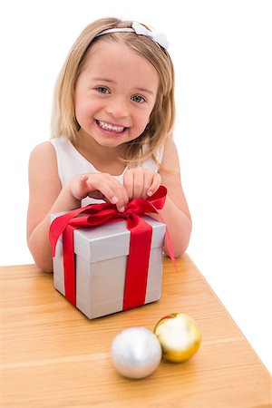 simsearch:400-07902186,k - Festive little girl opening a gift on white background Foto de stock - Super Valor sin royalties y Suscripción, Código: 400-07902114
