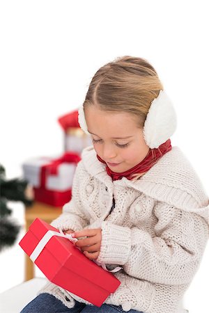 simsearch:400-07902186,k - Festive little girl holding a gift on white background Foto de stock - Super Valor sin royalties y Suscripción, Código: 400-07902119