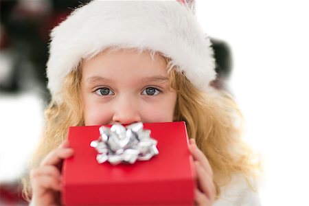 simsearch:400-07902186,k - Festive little girl holding a gift on white background Foto de stock - Super Valor sin royalties y Suscripción, Código: 400-07902174