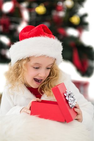 simsearch:400-07753751,k - Festive little girl looking at gift on white background Stock Photo - Budget Royalty-Free & Subscription, Code: 400-07902172