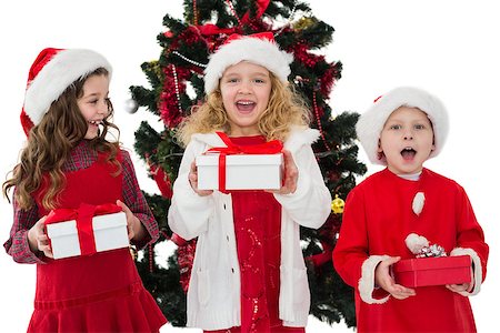 simsearch:400-07753751,k - Festive little siblings holding gifts on white background Stock Photo - Budget Royalty-Free & Subscription, Code: 400-07902184