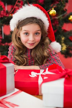 simsearch:400-07753751,k - Festive little girl with gifts on red background Stock Photo - Budget Royalty-Free & Subscription, Code: 400-07902230
