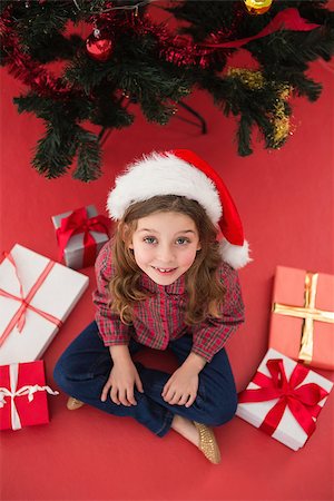 simsearch:400-07753751,k - Festive little girl with gifts on red background Stock Photo - Budget Royalty-Free & Subscription, Code: 400-07902231