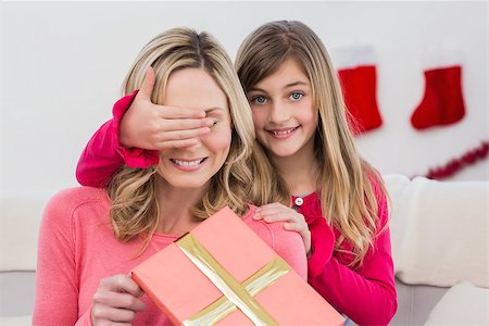 simsearch:400-07902186,k - Little girl hiding gift from mother at home in the living room Foto de stock - Super Valor sin royalties y Suscripción, Código: 400-07902330