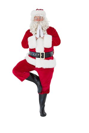 people isolated christmas - Santa claus in tree pose on white background Stock Photo - Budget Royalty-Free & Subscription, Code: 400-07902430