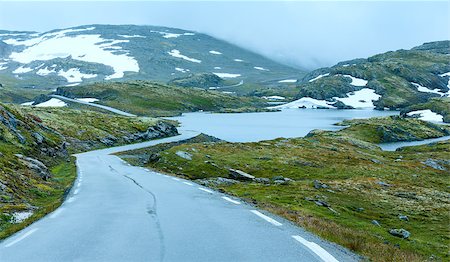 simsearch:400-06748366,k - Summer mountain misty landscape with road, lake and snow (Norway, Aurlandsfjellet). Stock Photo - Budget Royalty-Free & Subscription, Code: 400-07902480