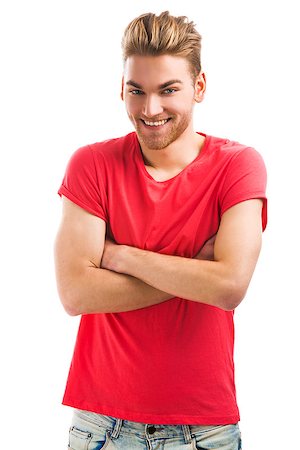 simsearch:400-05912369,k - Handsome young man smiling and looking to the camera, isolated on white background Fotografie stock - Microstock e Abbonamento, Codice: 400-07903115