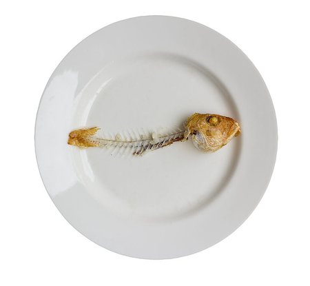fish bones on plate - Fishbone on plate isolated on white background with clipping path Stock Photo - Budget Royalty-Free & Subscription, Code: 400-07903289