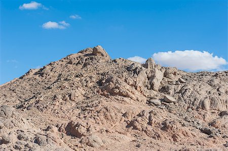 simsearch:400-06749010,k - Peak of rocky mountain in arid desert landscape against blue sky background Foto de stock - Super Valor sin royalties y Suscripción, Código: 400-07903734