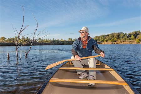simsearch:400-07176700,k - senior paddler enjoying morning sun on lake in a canoe, Riverbend Ponds Natural Area, Fort Collins, Colorado Foto de stock - Super Valor sin royalties y Suscripción, Código: 400-07914187