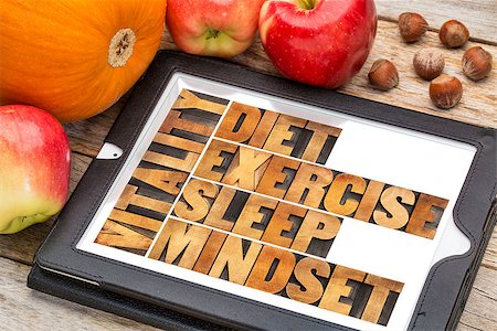 simsearch:400-08223086,k - diet, sleep, exercise and mindset - vitality concept - abstract in vintage letterpress wood type on a digital tablet with apples, pumpkin and hazelnuts Photographie de stock - Aubaine LD & Abonnement, Code: 400-07914673