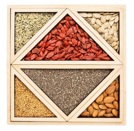 simsearch:400-08222274,k - square and triangles - superfood abstract -  chia seeds , dried goji berries, golden flax, pumpkin seeds, almonds and hemp seed hearts Photographie de stock - Aubaine LD & Abonnement, Code: 400-07914681