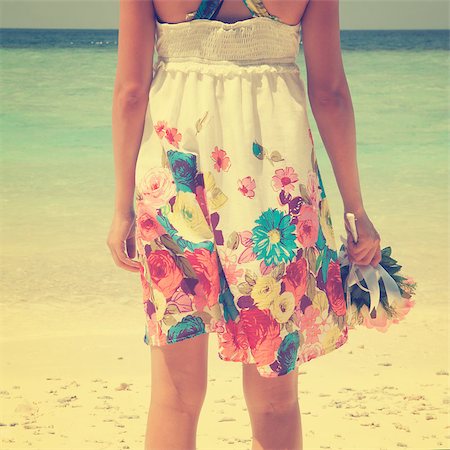 simsearch:400-07715201,k - Rear view single girl standing alone at beach, hand holding flower bouquet in vintage toned. Stock Photo - Budget Royalty-Free & Subscription, Code: 400-07915126