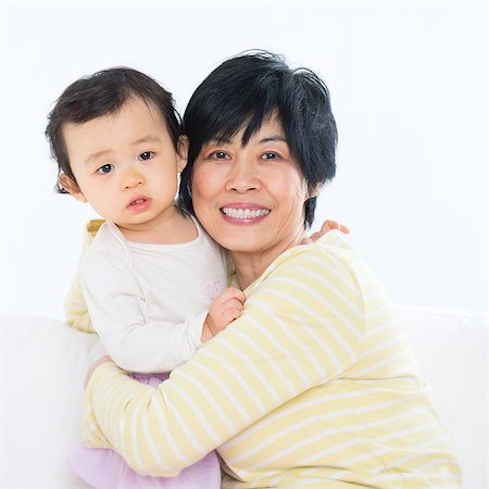 simsearch:400-04300757,k - Asian family portrait, grandma and grandchild indoor living lifestyle at home. Photographie de stock - Aubaine LD & Abonnement, Code: 400-07915144