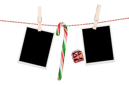 simsearch:400-06463913,k - Blank photo frames and candy cane hanging on the clothesline. Isolated on white background Foto de stock - Super Valor sin royalties y Suscripción, Código: 400-07915180