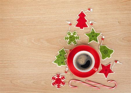 Christmas decor and coffee cup over wooden table background with copy space Stock Photo - Budget Royalty-Free & Subscription, Code: 400-07915221