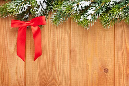 Wood texture with snow firtree christmas background and red bow Stock Photo - Budget Royalty-Free & Subscription, Code: 400-07915259