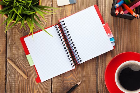 simsearch:400-07179441,k - Office table with flower, blank notepad and coffee cup. View from above with copy space Foto de stock - Royalty-Free Super Valor e Assinatura, Número: 400-07915267