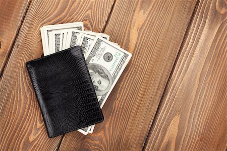 Money cash wallet on wooden table with copy space Stock Photo - Budget Royalty-Free & Subscription, Code: 400-07915275