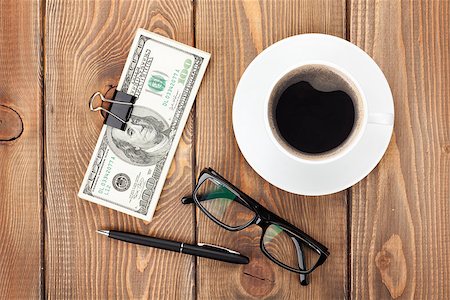 simsearch:400-07915276,k - Money cash, glasses, pen and coffee cup on wooden table Photographie de stock - Aubaine LD & Abonnement, Code: 400-07915278