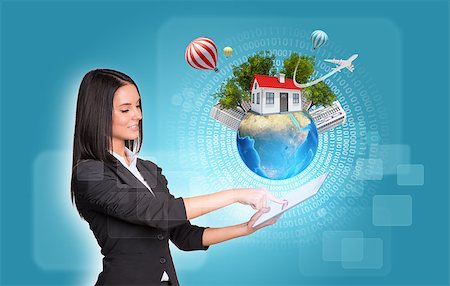 simsearch:400-07821752,k - Beautiful businesswomen in suit using digital tablet. Earth with house and trees. Figures as backdrop. Element of this image furnished by NASA Foto de stock - Royalty-Free Super Valor e Assinatura, Número: 400-07915434