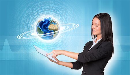 simsearch:400-07895693,k - Beautiful businesswomen in suit using digital tablet. Earth with figures and graphs. Element of this image furnished by NASA Stock Photo - Budget Royalty-Free & Subscription, Code: 400-07915437