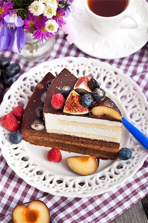 Piece of chocolate layer cake with cream and fresh fruit Stock Photo - Budget Royalty-Free & Subscription, Code: 400-07915779