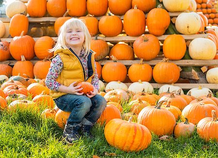 simsearch:400-07916492,k - Portrait of happy child sitting on pumpkin Stock Photo - Budget Royalty-Free & Subscription, Code: 400-07916473
