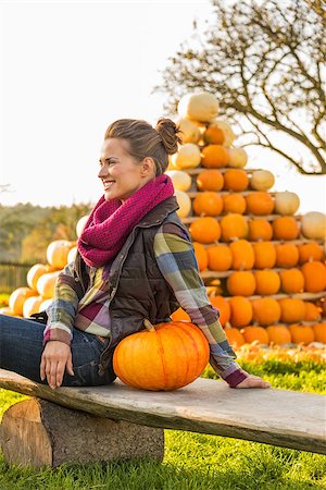 simsearch:400-07916492,k - Smiling young woman sitting with pumpkin Stock Photo - Budget Royalty-Free & Subscription, Code: 400-07916508