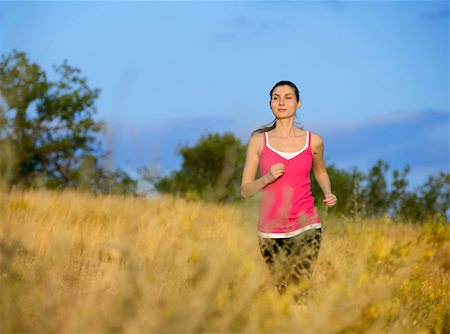simsearch:6109-06004563,k - Young Beautiful Woman Running on the Mountain Trail in the Morning. Active Lifestyle Stockbilder - Microstock & Abonnement, Bildnummer: 400-07916709